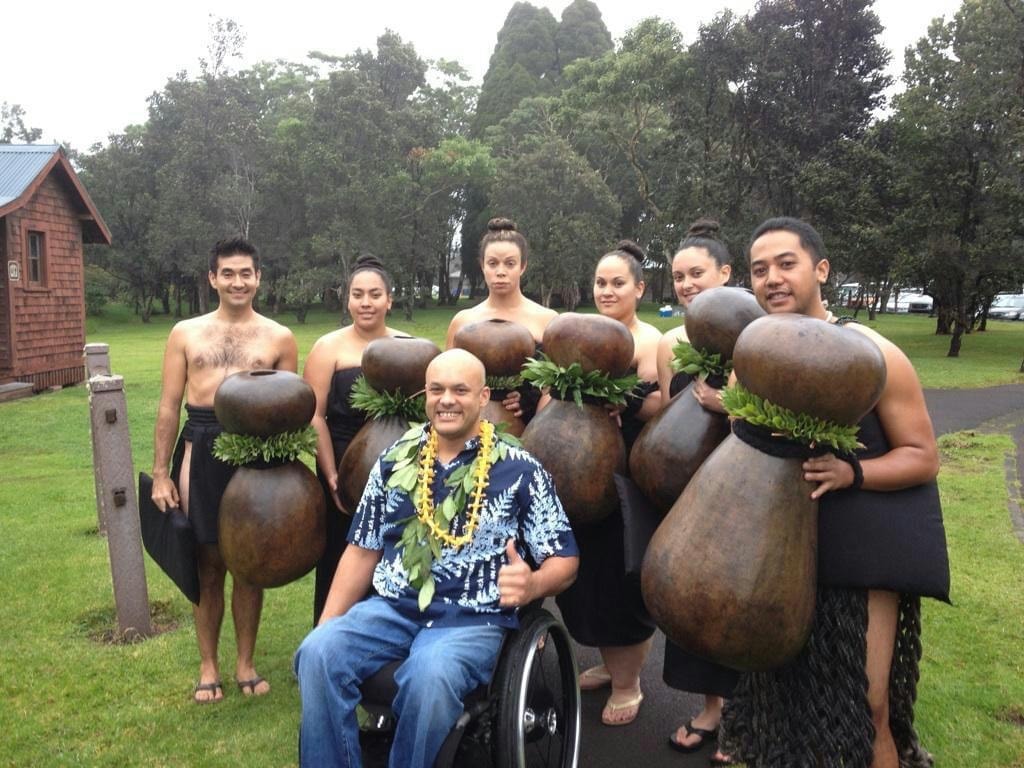 Kalim H. Smith with students holding ipu heke before a performance in Volcano, Hawaiʻi
